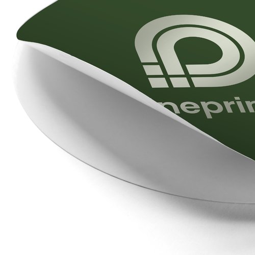 Autocollant promotionnel rond avec un support amovible.