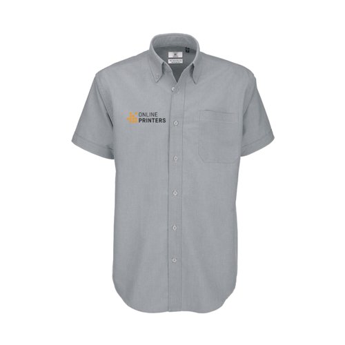 Chemise  manches courtes en mlange de coton gris clair avec patte boutonne et poche poitrine.