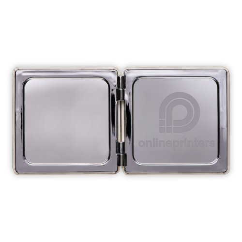 Miroir grossissant argenté pliable.