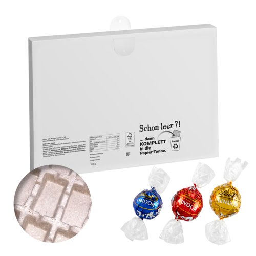 Calendrier de l'Avent blanc en carton avec garniture.