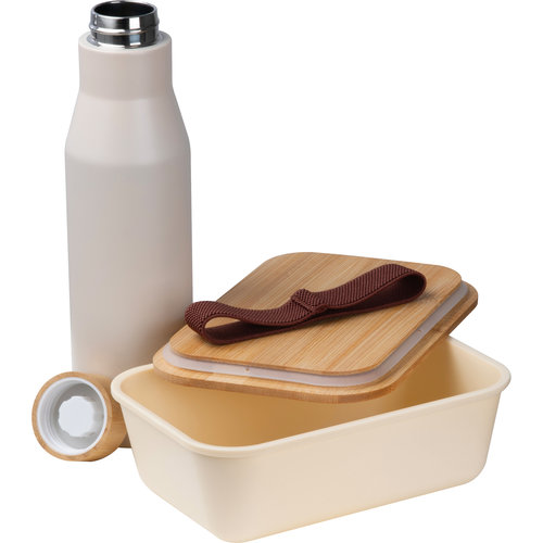 Bote  djeuner beige avec bouteille en acier inoxydable et couvercle en bambou.