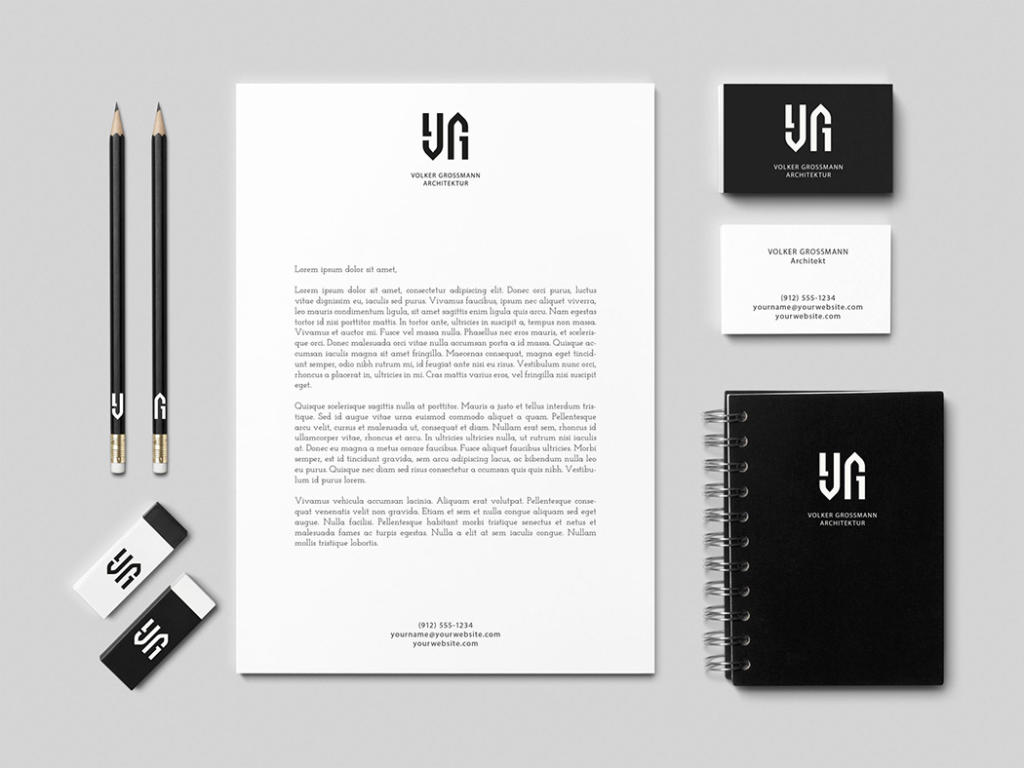 Un ensemble de papeterie minimaliste comprenant du papier à en-tête, des cartes de visite, des crayons, des gommes et un carnet. Le design arbore un logo ambigramme moderne et une palette de couleurs monochromes, soulignant professionnalisme et simplicité.