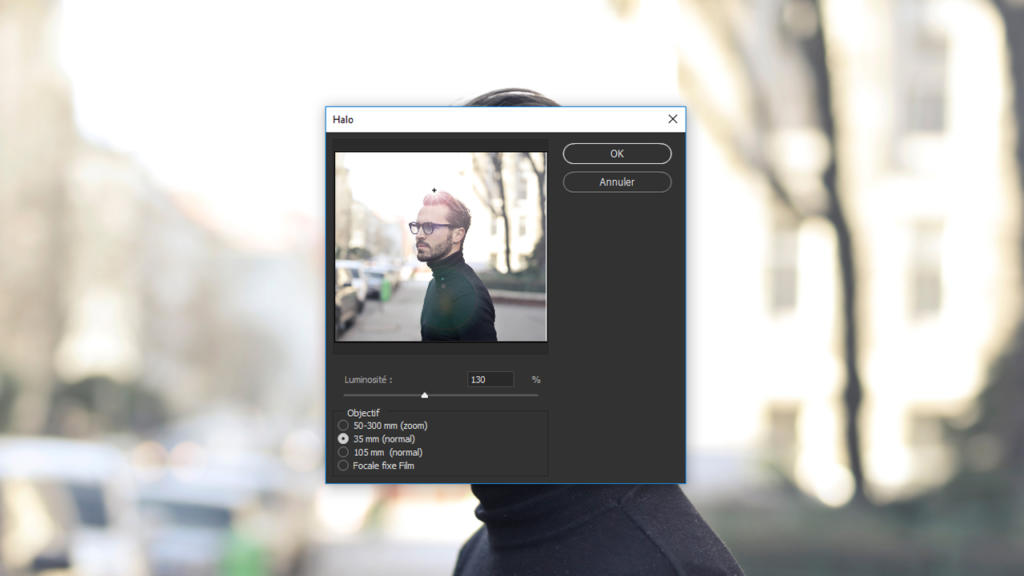 Sur la photo d'une personne aux cheveux courts et portant des lunettes, portant un col roulé noir, on voit en superposition une fenêtre d'ordinateur affichant les paramètres d'« effet de halo » en français. L'interface ressemble aux outils de halo de Photoshop, avec des options d'intensité et des points focaux visibles sur un arrière-plan flou.