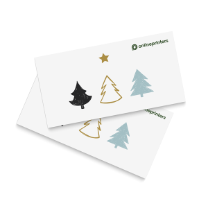 Deux cartes de Noël aux motifs minimalistes représentant trois sapins et une étoile en noir, or et bleu clair. Le logo « onlineprinters » figure en haut à droite de chaque carte. Les cartes se chevauchent sur fond blanc.
